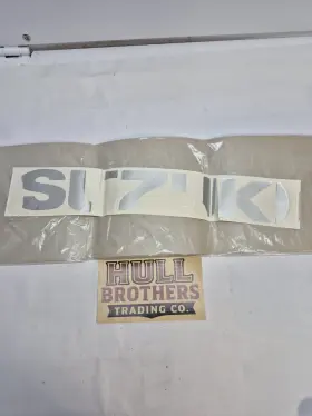68191-34E10-Y2D SUZUKI Emblem Graphic Sticker Lower Left Cowl
