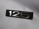 SUZUKI   1973 TS125 TC125  NOS SIDE COVER EMBLEM    68141-28600